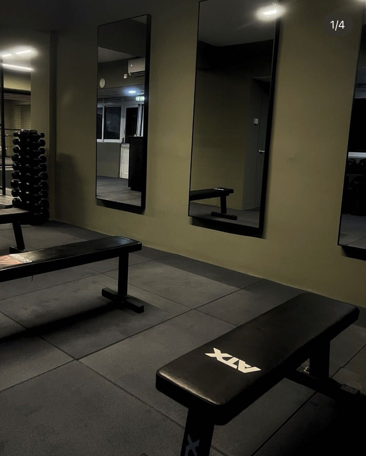Benches, dumbbells and mirrors on the training floor at FIIT Paphos